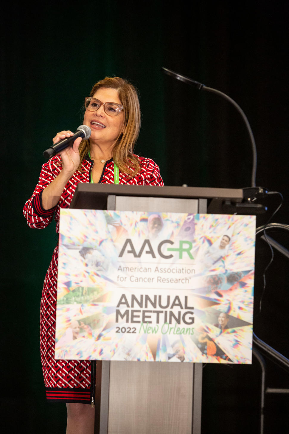 Dr. Marcia Cruz-Correa speaks from the lectern at the AACR Annual Meeting 2022.