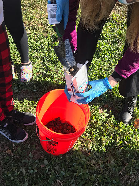 Middle school participants in the Indigenous Research (IResearch) Club preparing composite soil samples to be tested for environmental carcinogens.