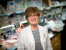 Photo of Dr. Suzanne Baker standing in her laboratory