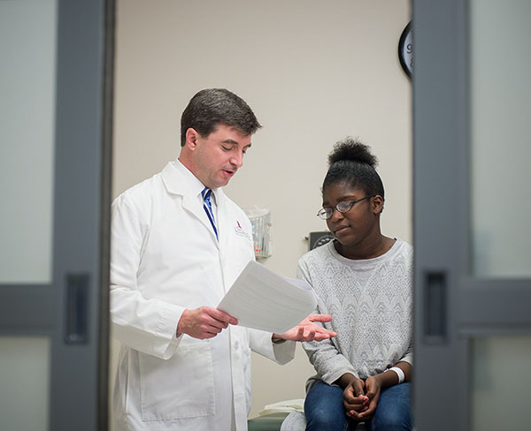 Dr. Greg Armstrong with a study participant