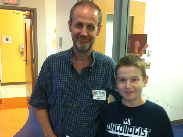 Brent Weston, M.D., and Harrison McKinion at UNC Lineberger Comprehensive Cancer Center