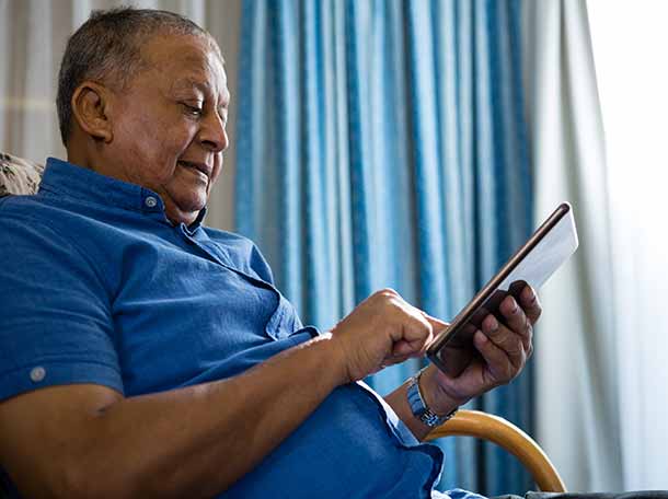 man looking at tablet