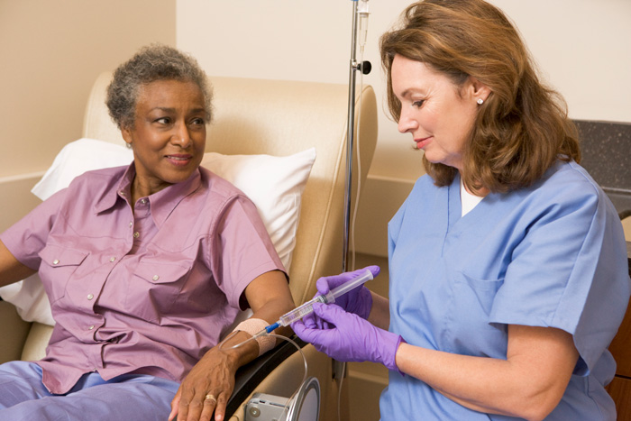 nurse giving patient an infusion