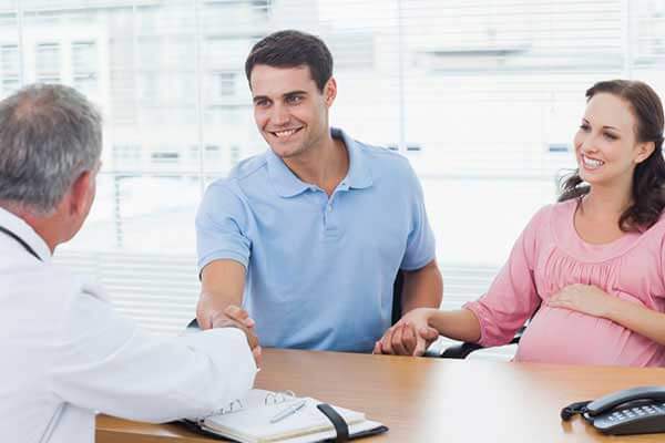 couple talking with doctor