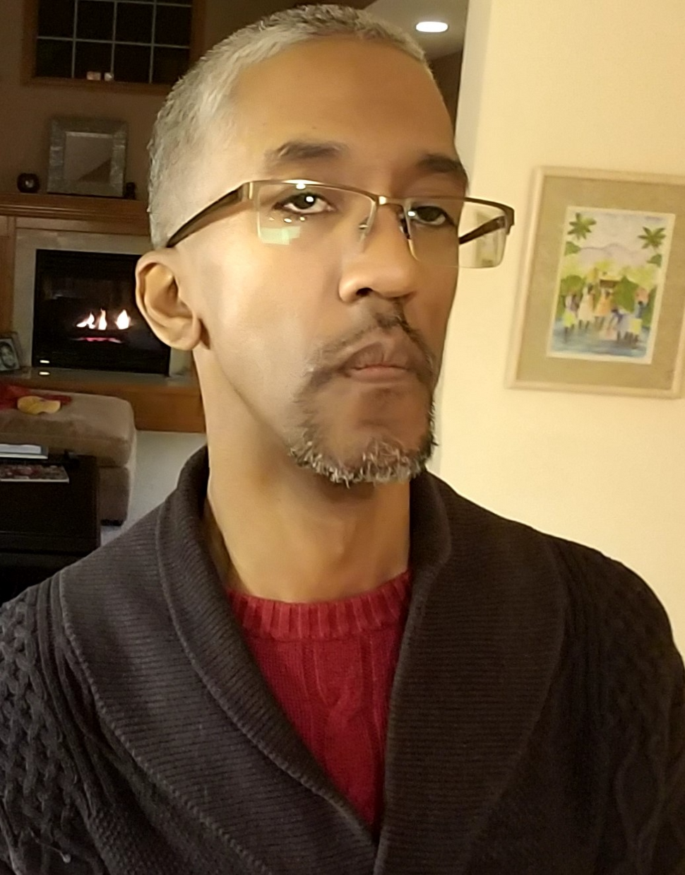 Connect participant Paris, a man wearing glasses, with a pensive expression