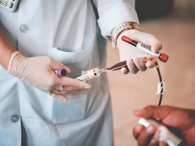 Nurse drawing a patient's blood
