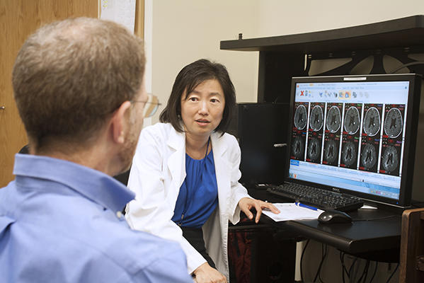 Dr. Jing Wu talking about brain MRI scans