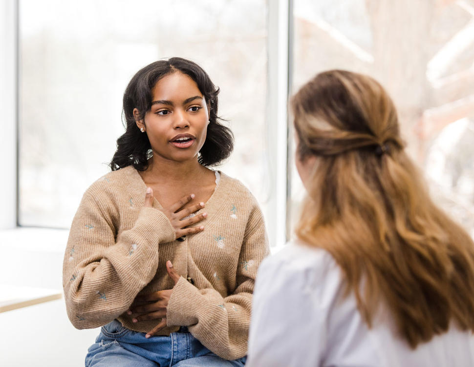 Teenage girl speaking with a doctor