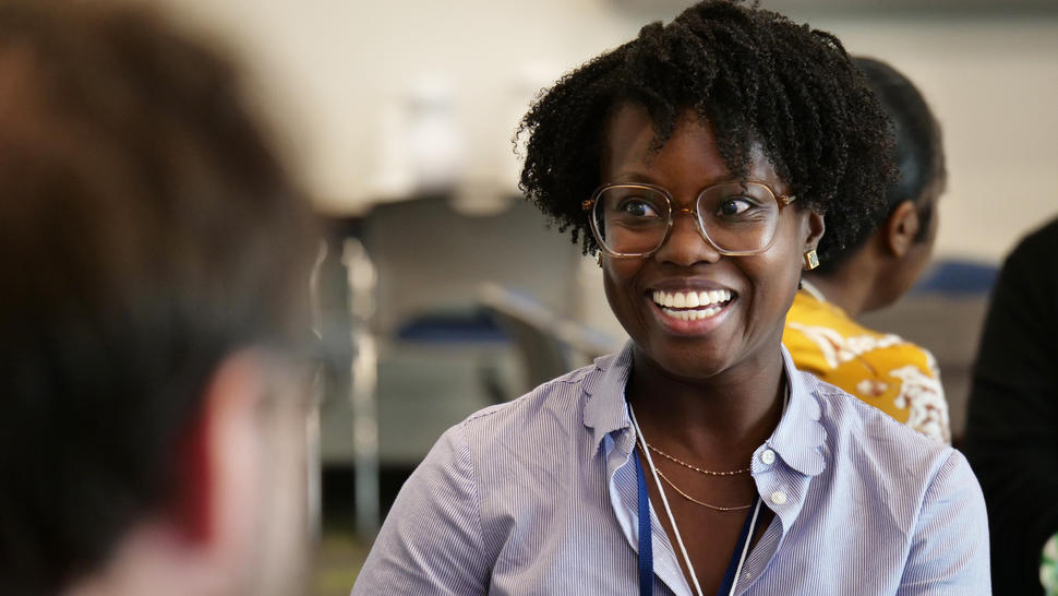 Alvina Acquaye-Mallory smiling as she talks to someone