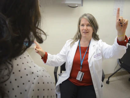 Dr. Armstrong conducts a cognitive assessment with a patient