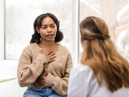 Teenage girl speaking with a doctor