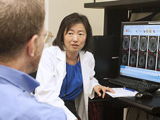 Dr. Jing Wu talking about brain MRI scans