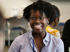 Alvina Acquaye-Mallory smiling as she talks to someone