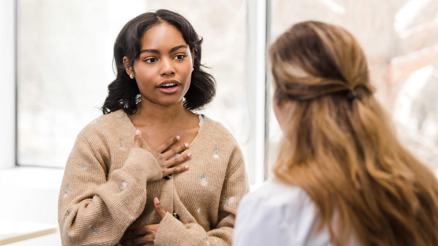 Teenage girl speaking with a doctor