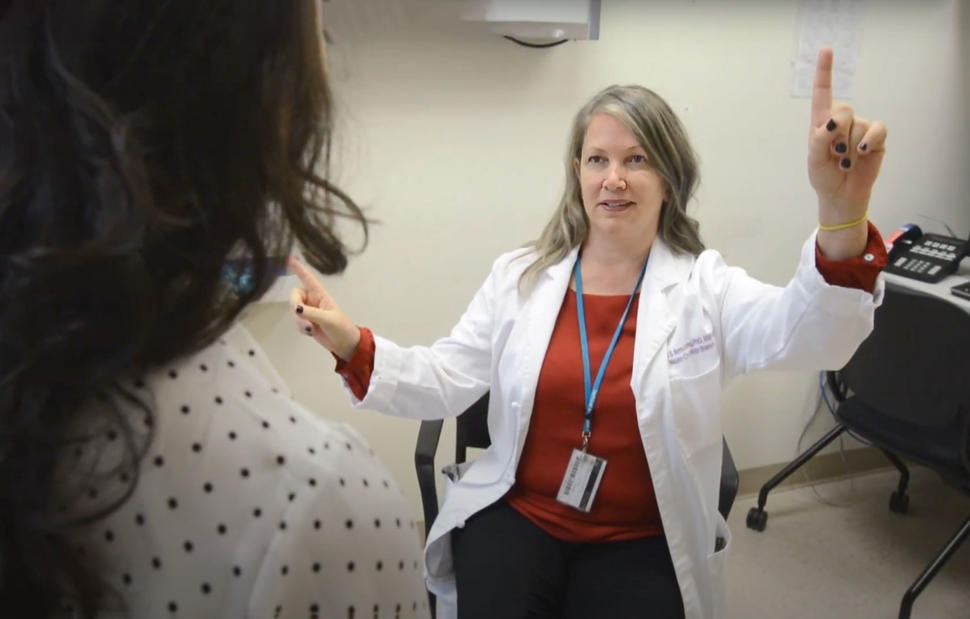 Dr. Armstrong conducts a cognitive assessment with a patient