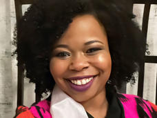 Donita smiling and wearing a birthday sash