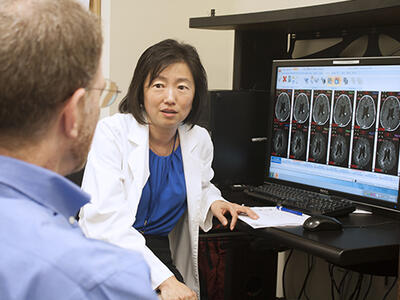 Dr. Jing Wu talking about brain MRI scans