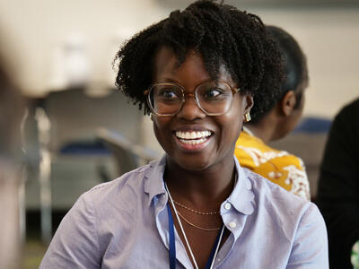 Alvina Acquaye-Mallory smiling as she talks to someone