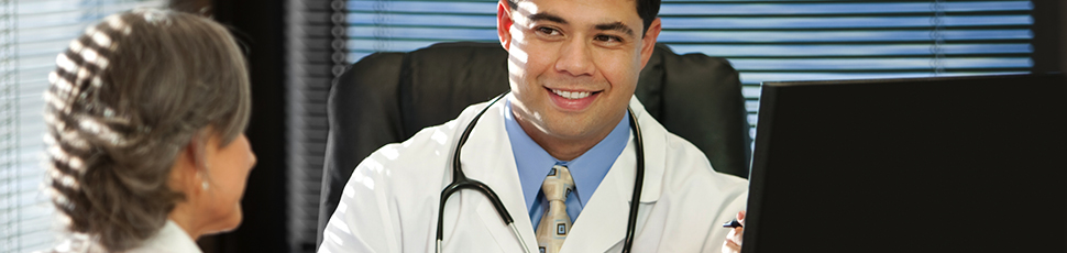 Doctor and patient sitting at desk