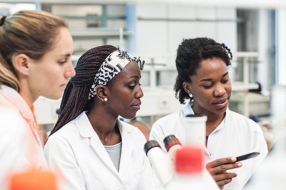 Three female scientists in a lab