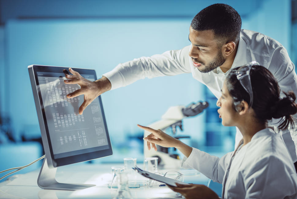 Female and Male Scientists Working in The Laboratory