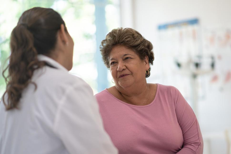 Doctor talking to Hispanic patient