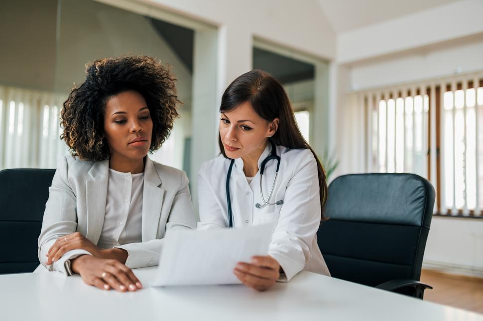 A doctor explaining results to her Black female patient 