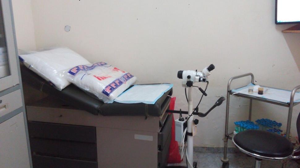 Photo of an exam table inside small clinic room in Nigeria