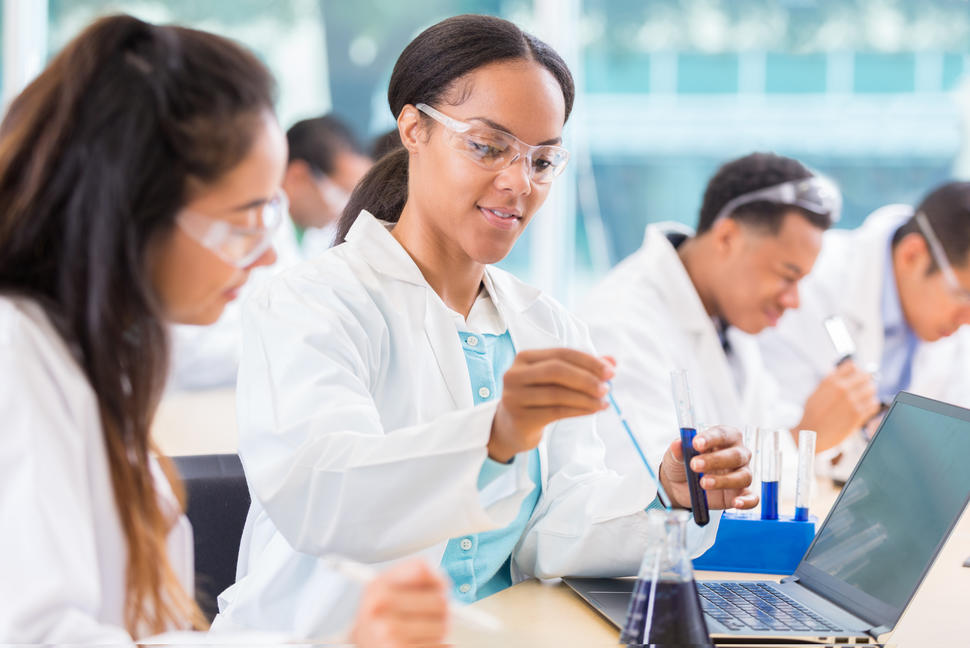 Chemists work on project in lab stock photo
