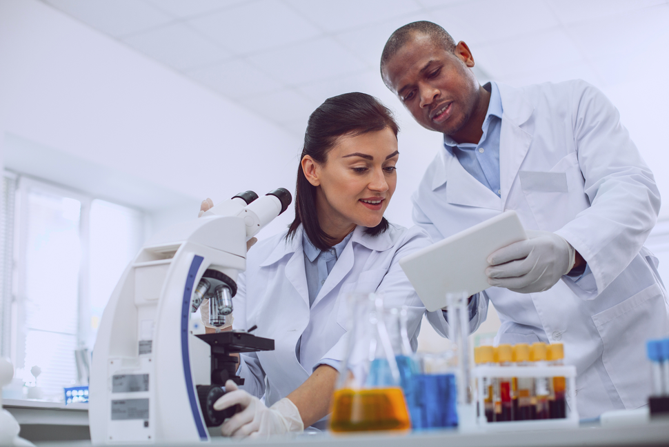 Female and Male Scientists Working in The Laboratory
