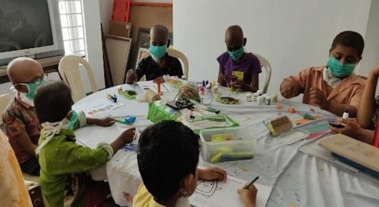 Children doing arts and crafts around a table