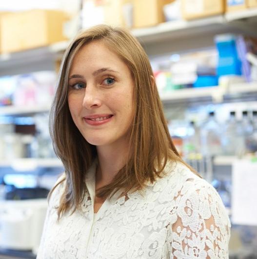 Photo of Dr. Ashley Laughney standing in a laboratory