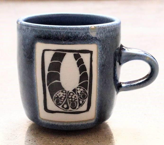 A ceramic mug with a scientific design created by Dr. Marian Waterman