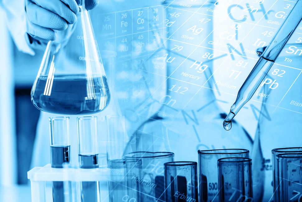 Test tubes and scientific glassware with a periodic table