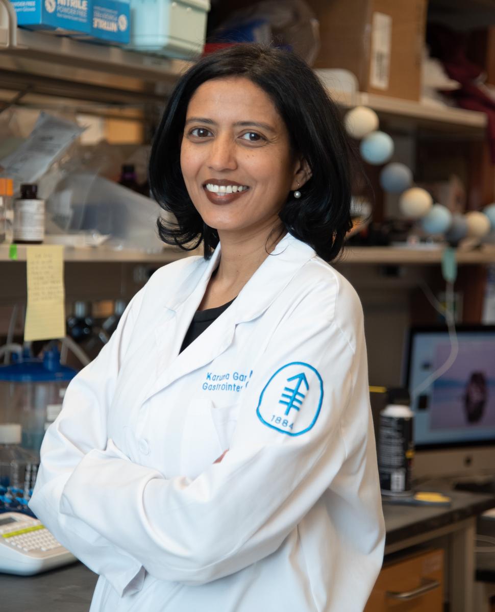 Photo of Dr. Karuna Ganesh standing in her laboratory