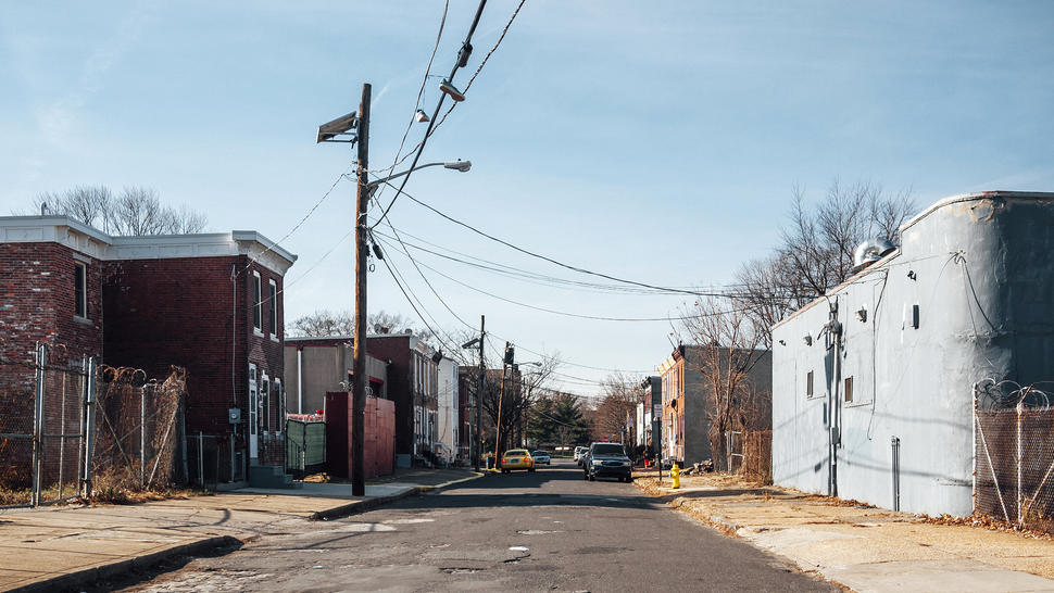 Run-down buildings line the streets of an impoverished town.  