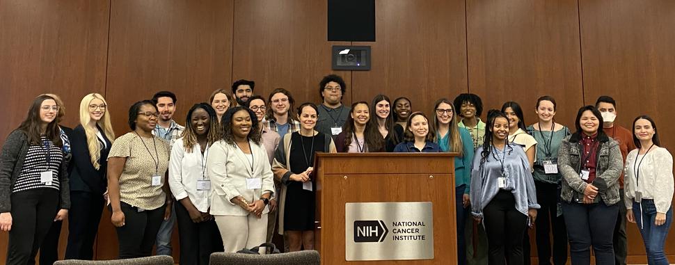 Active and transitioning iCURE Scholars pose as a group during the 2023 iCURE Year-End Gathering.