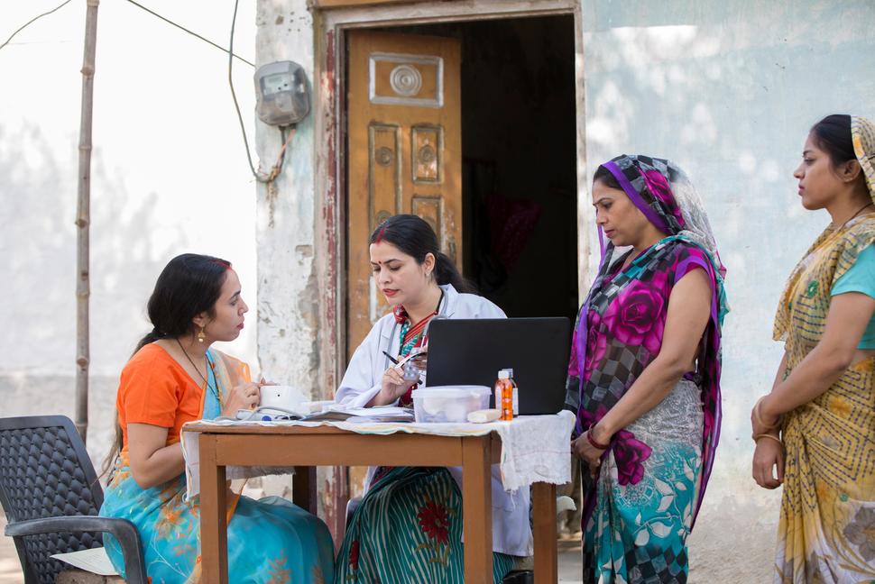 female doctor doing social service in village in India 3 women