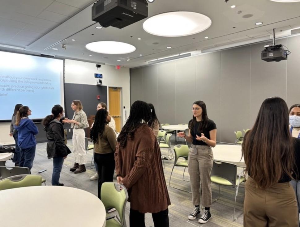 Fellows practicing their 3-minute talks in preparation for Poster Day 