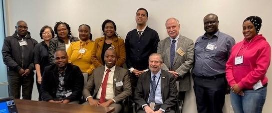 Group photo of the IVLP participants from Kenya, Dr. Doug Lowy, Dr. Satish Gopal, and Dr. Patrick J. Loehrer