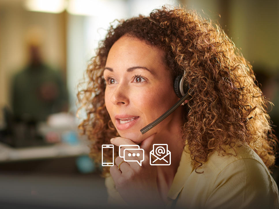 Representative on a headset helping a patient who has called in for assistance