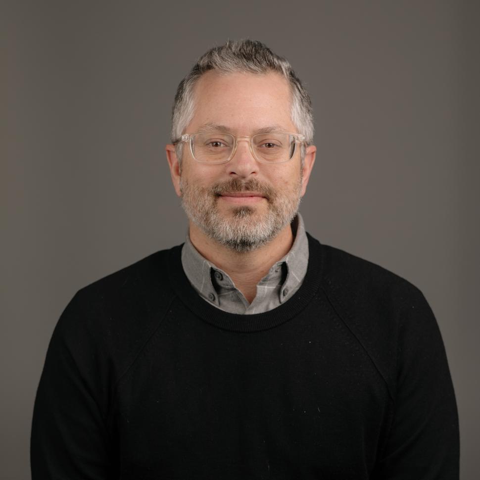 Professional headshot of Dr. Logan Spector