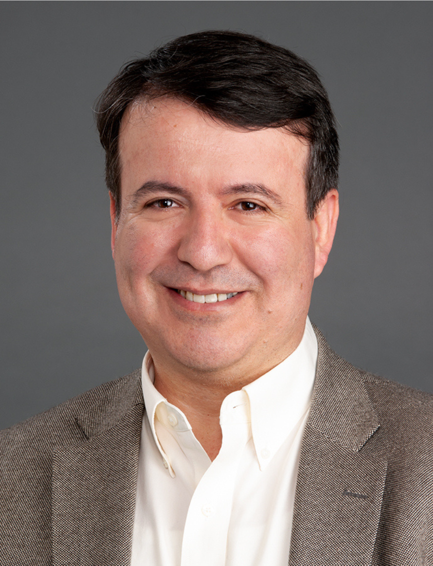 Headshot of Umit Topaloglu.