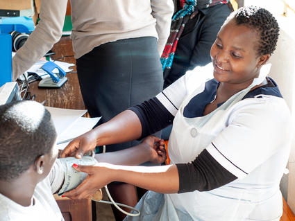A nurse with a patient at Kamuzu Central Hospital in Malawi