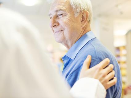 Older man talking with a doctor