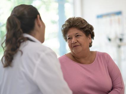 Doctor talking to Hispanic patient