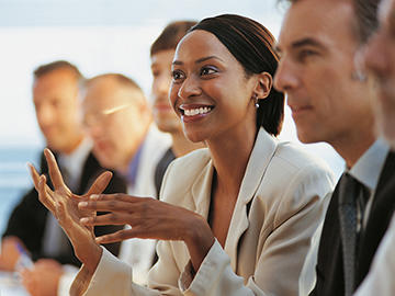 Woman speaking in a business meeting.