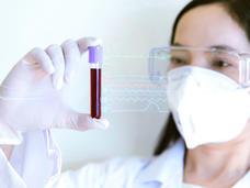 Female scientists with blood collection tube