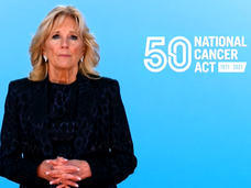 Image of First Lady Dr. Jill Biden against blue backdrop with 50th anniversary of the National Cancer Act of 1971