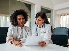 A doctor explaining results to her Black female patient 